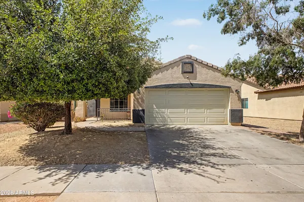 a front view of a house with a garage