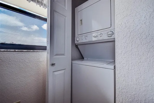 a view of kitchen with stainless steel appliances cabinets and stove