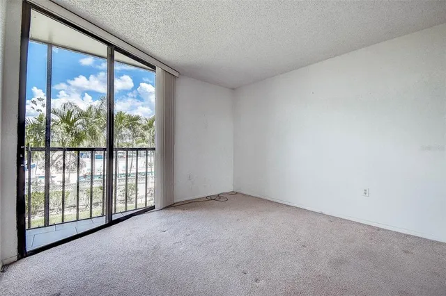 a view of an empty room with a balcony