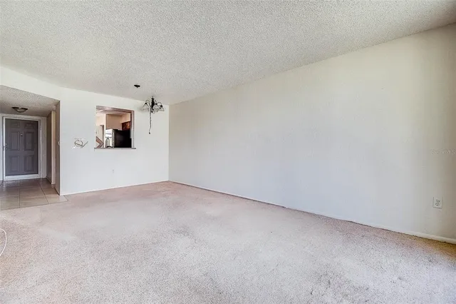 a view of a kitchen from the hallway