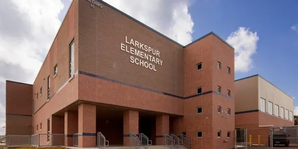 a front view of a building with many windows