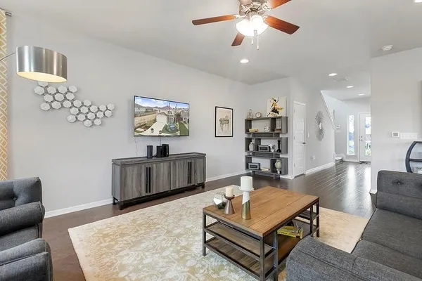 a living room with furniture and a flat screen tv