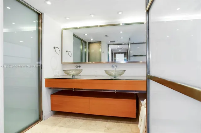 a bedroom with furniture and a flat screen tv