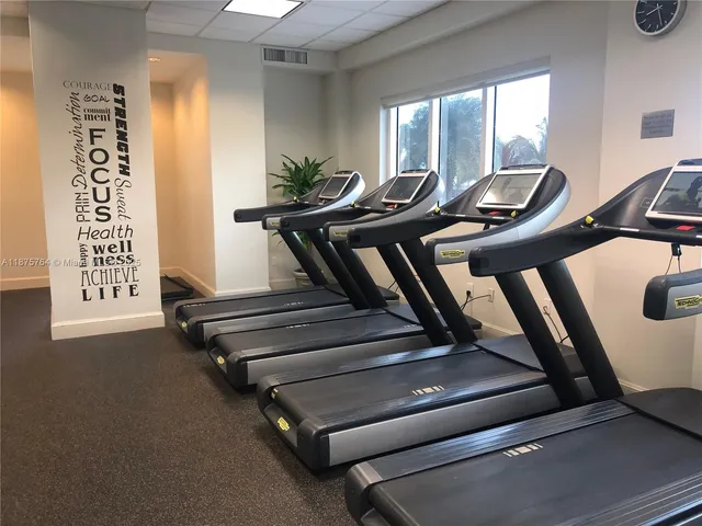 a room with gym equipment and window