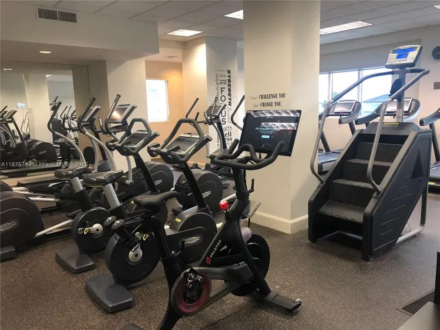 front view of a building with a table and chairs