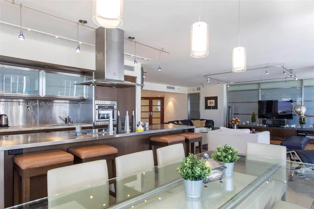 a view of a dining room with furniture window and outside view