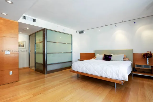 a view of a kitchen with a sink stainless steel appliances and cabinets