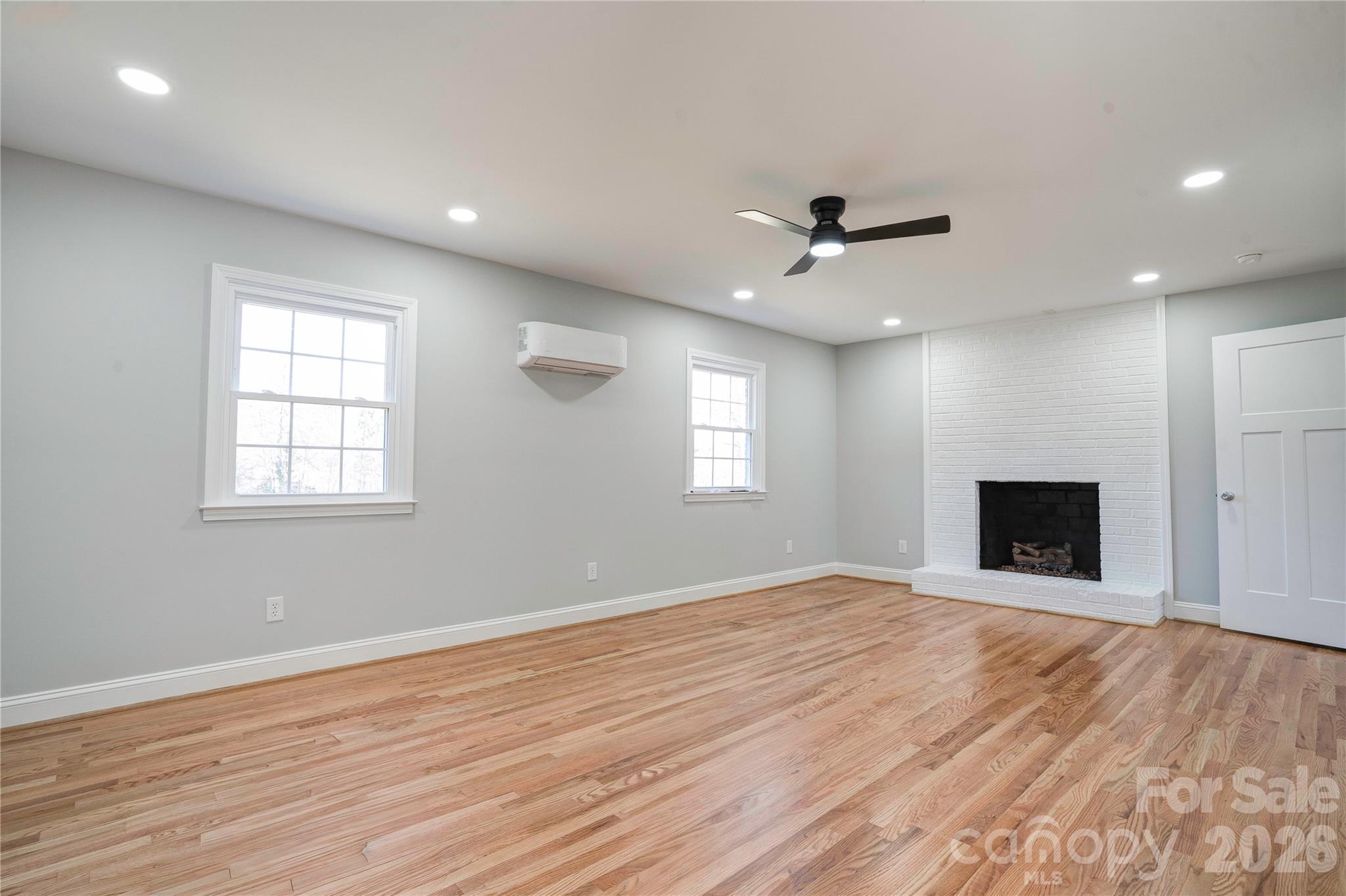 2822 Bettis Road Grover, NC 28073 - Photo 24 of 32 an empty room with wooden floor and a ceiling fan
