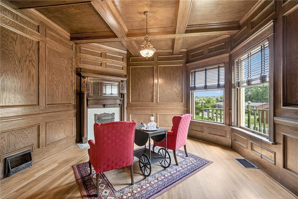 24 Shady Avenue Burgettstown, PA 15021 - Photo 9 of 50 Gorgeous wood paneling and corner decorative fireplace are highlighted in the parlor.