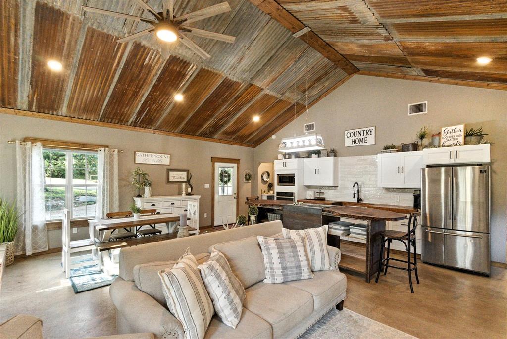 11140 Light Road Lipan, TX 76462 - Photo 14 of 37 a living room with stainless steel appliances granite countertop lots of furniture and a kitchen view