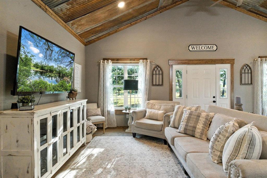 11140 Light Road Lipan, TX 76462 - Photo 15 of 37 a living room with furniture and a flat screen tv