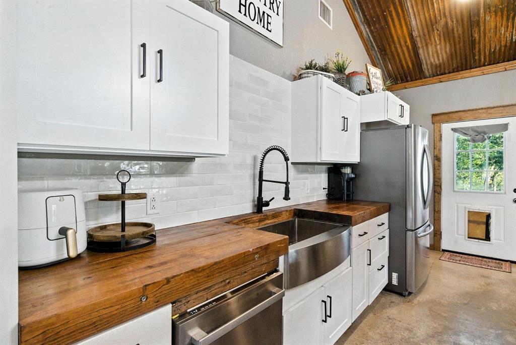 11140 Light Road Lipan, TX 76462 - Photo 16 of 37 a kitchen that has a sink and cabinets
