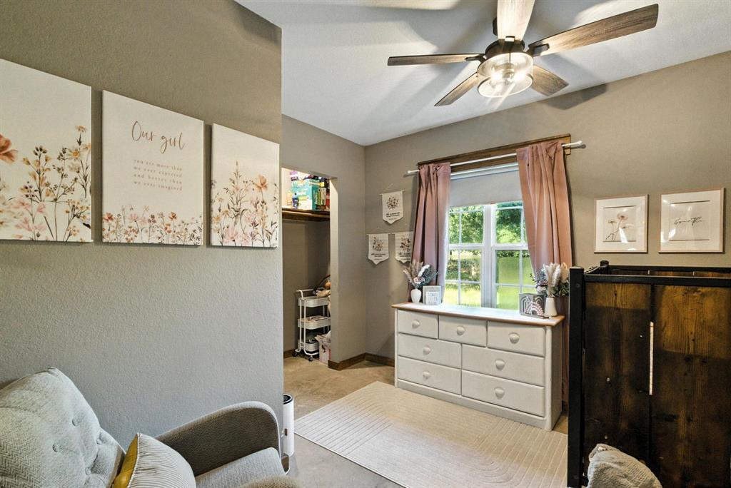 11140 Light Road Lipan, TX 76462 - Photo 21 of 37 a bedroom with a bed dresser and a window
