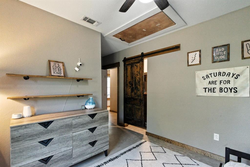11140 Light Road Lipan, TX 76462 - Photo 24 of 37 a kitchen with granite countertop white cabinets and refrigerator