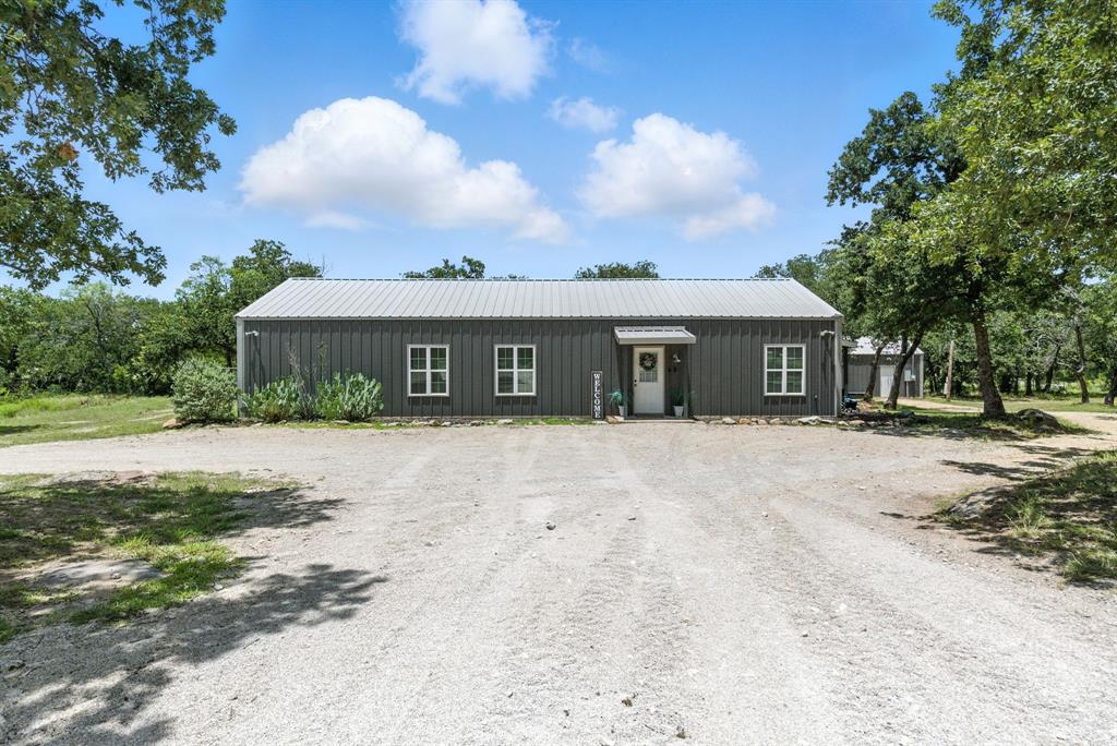 11140 Light Road Lipan, TX 76462 - Photo 26 of 37 a view of a house with a yard