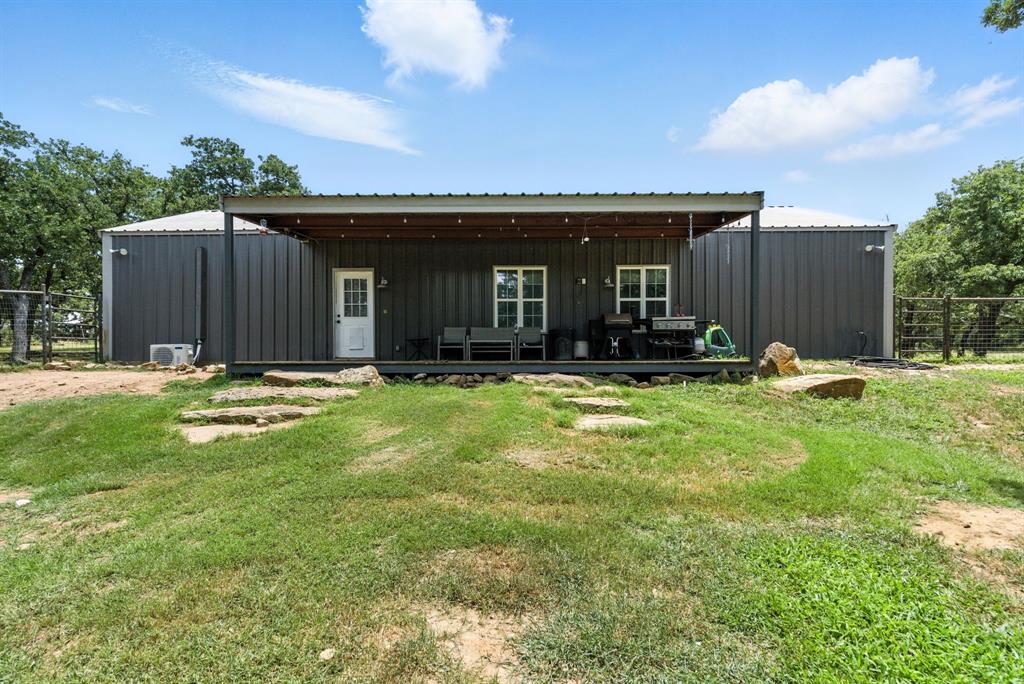 11140 Light Road Lipan, TX 76462 - Photo 27 of 37 a view of a house with backyard and porch