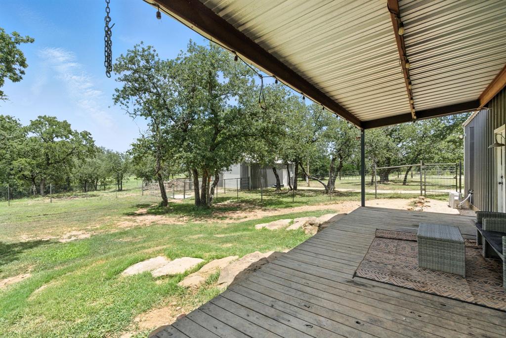 11140 Light Road Lipan, TX 76462 - Photo 28 of 37 a view of a house with a yard