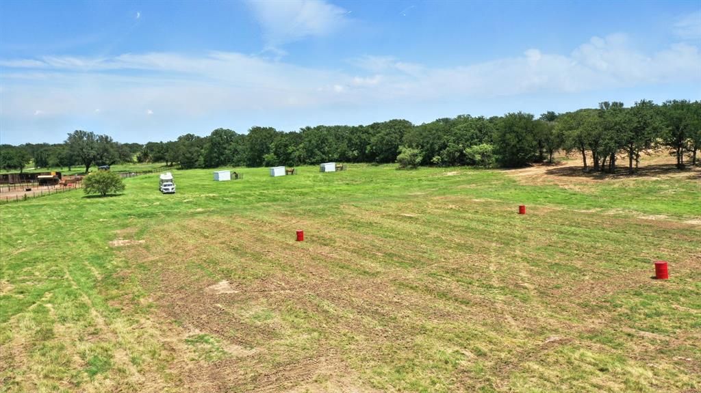 11140 Light Road Lipan, TX 76462 - Photo 4 of 37 a view of outdoor space with green field and trees