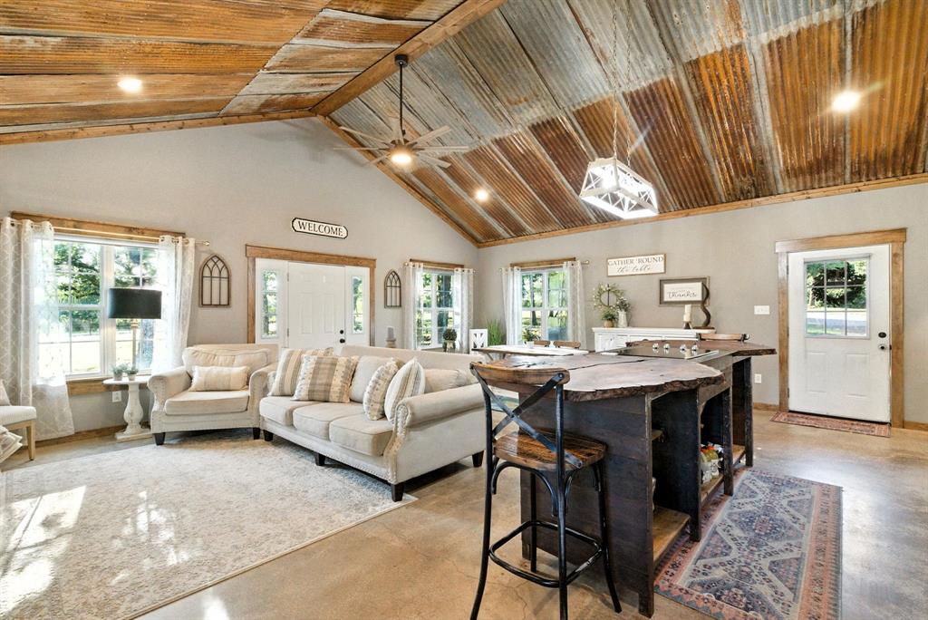 11140 Light Road Lipan, TX 76462 - Photo 7 of 37 a view of a livingroom with furniture window and wooden floor