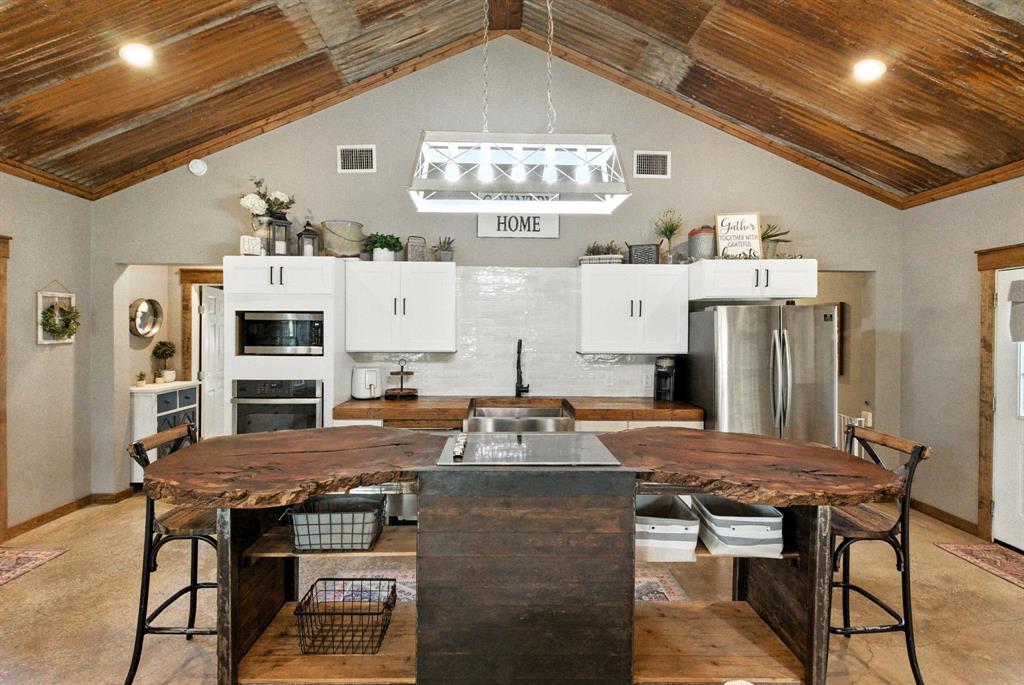 11140 Light Road Lipan, TX 76462 - Photo 8 of 37 a kitchen with a table and chairs in it