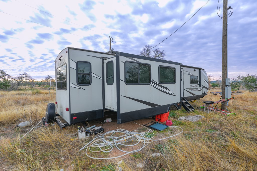875 Old Harper Road Harper, TX 78631 - Photo 31 of 42 a view of a house with backyard