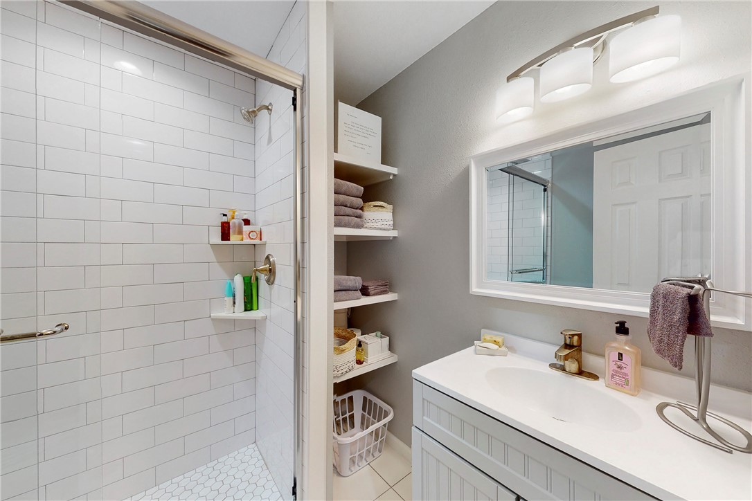 513 Boyett Street, Unit 2 College Station, TX 77840 - Photo 10 of 22 a bathroom with a sink and a mirror