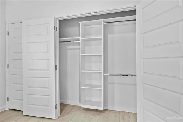 a kitchen with stainless steel appliances granite countertop a sink a stove and a microwave