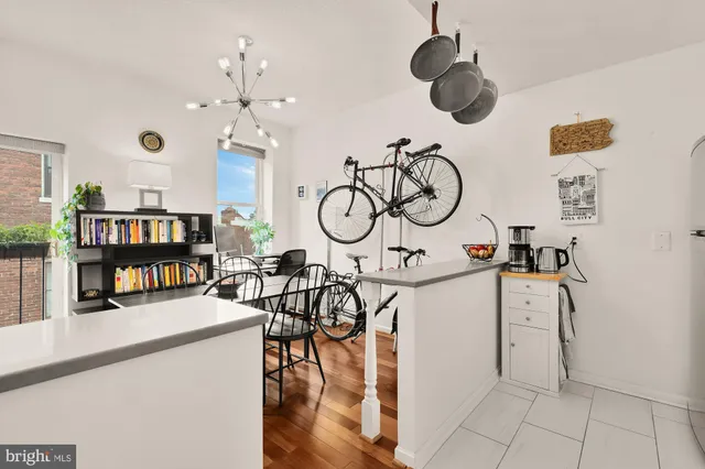 a view of living room with furniture and wooden floor