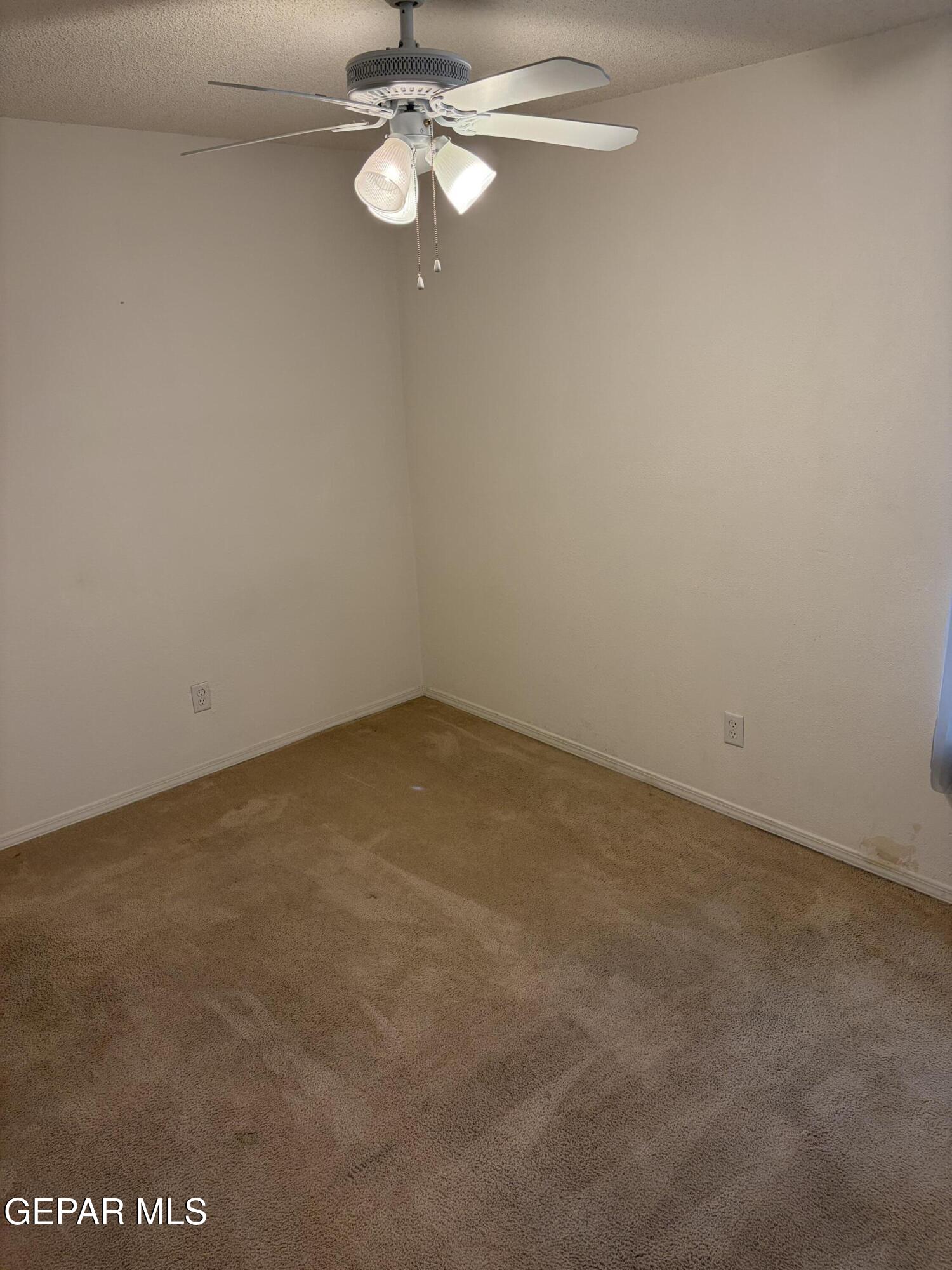 10735 Thunder Road El Paso, TX 79927 - Photo 15 of 32 a view of a room with a hanging light and kitchen view