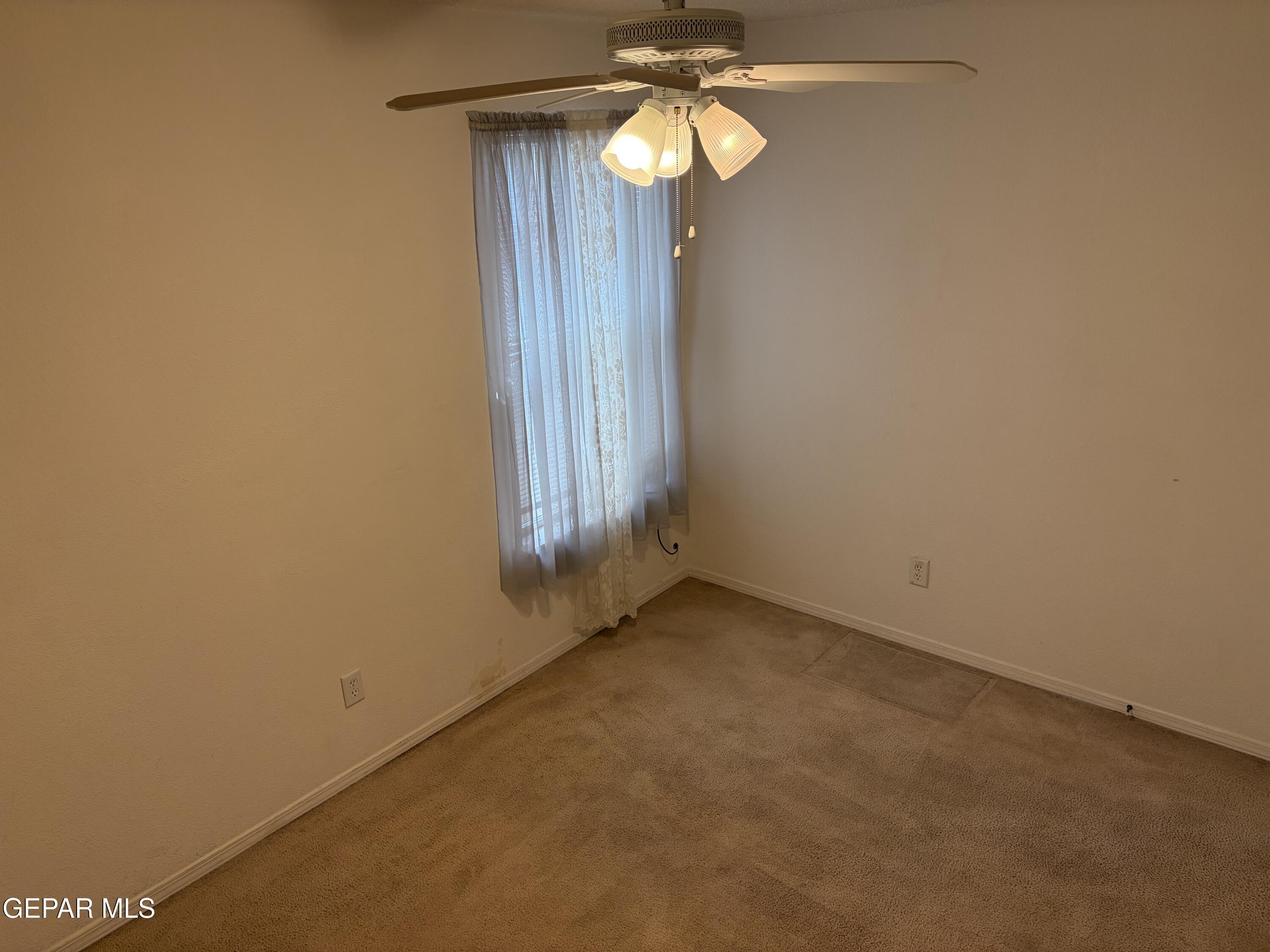 10735 Thunder Road El Paso, TX 79927 - Photo 18 of 32 a view of empty room with a window
