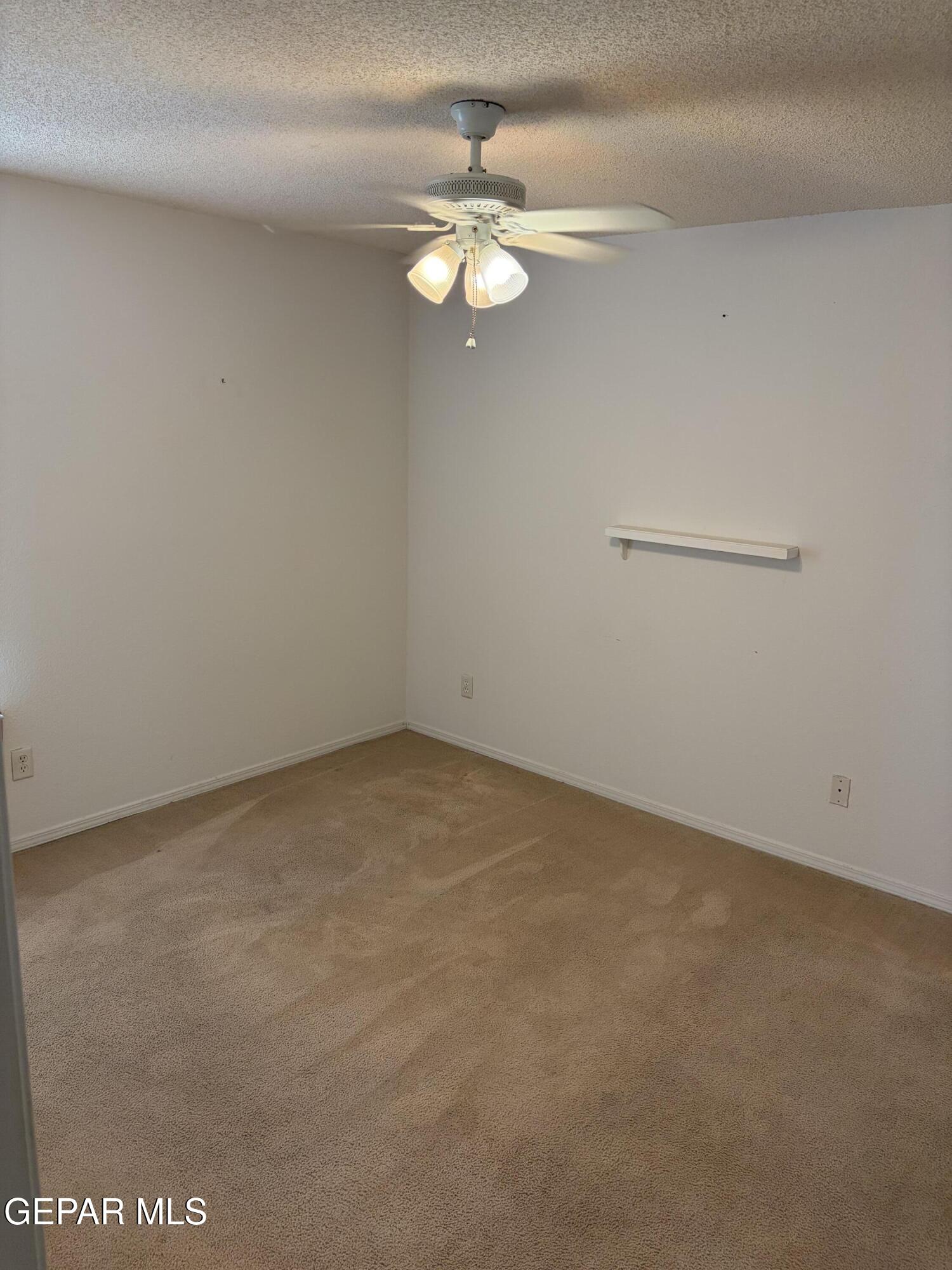 10735 Thunder Road El Paso, TX 79927 - Photo 20 of 32 a view of a small space with a chandelier fan