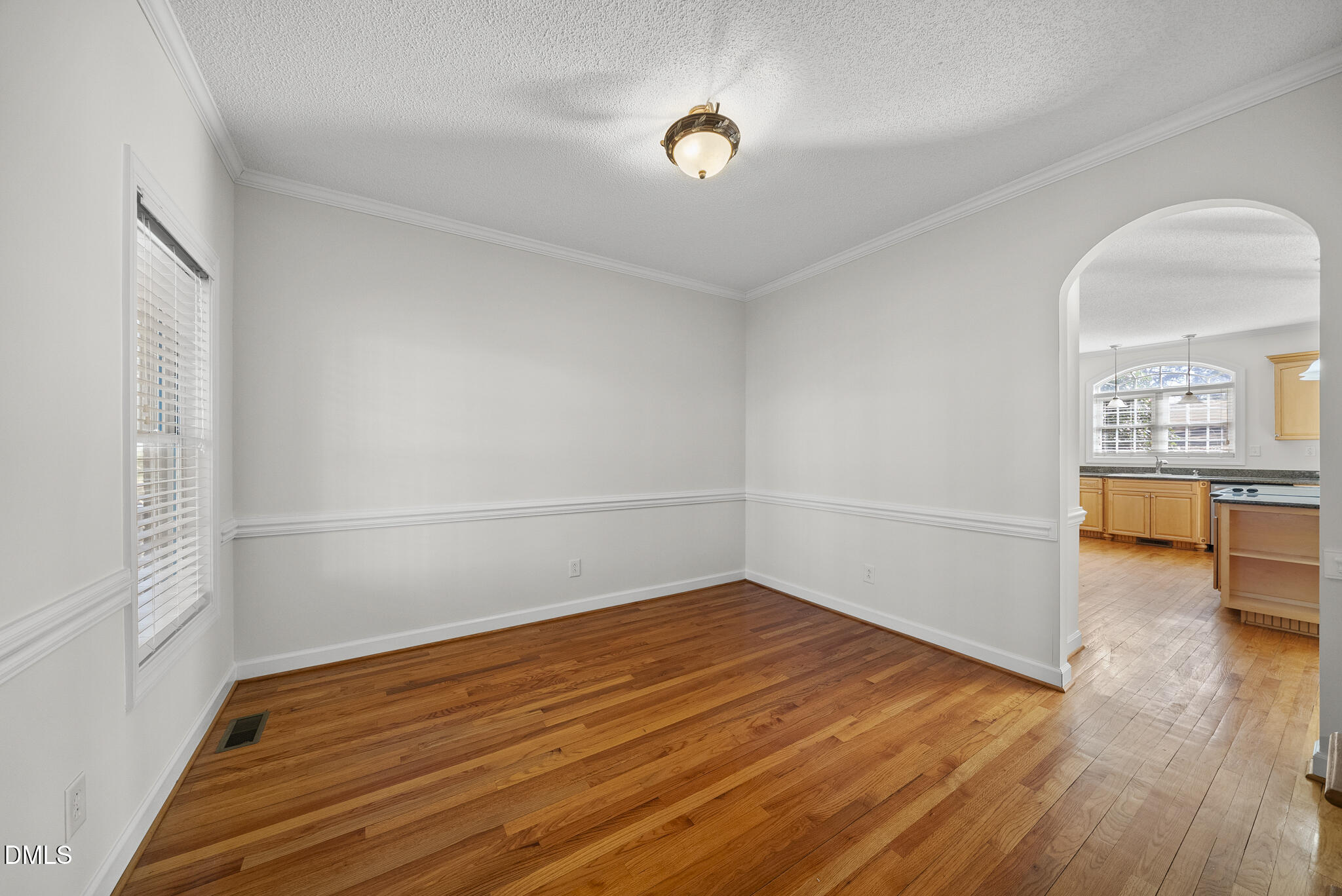 5833 Mockingbird Lane Sanford, NC 27332 - Photo 11 of 34 a view of empty room with wooden floor