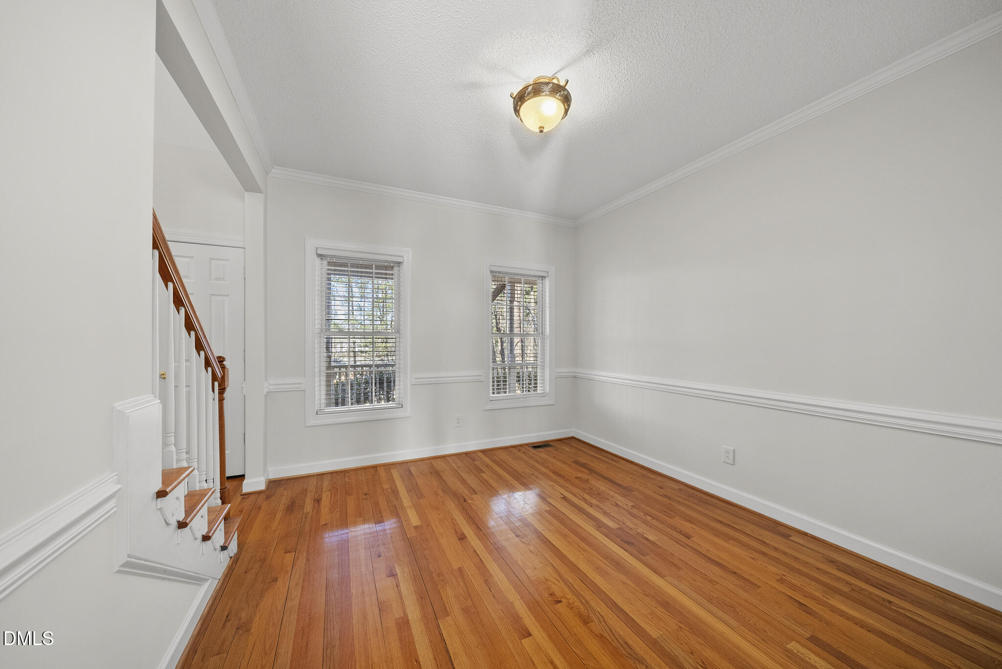 5833 Mockingbird Lane Sanford, NC 27332 - Photo 12 of 34 a view of empty room with wooden floor and fan
