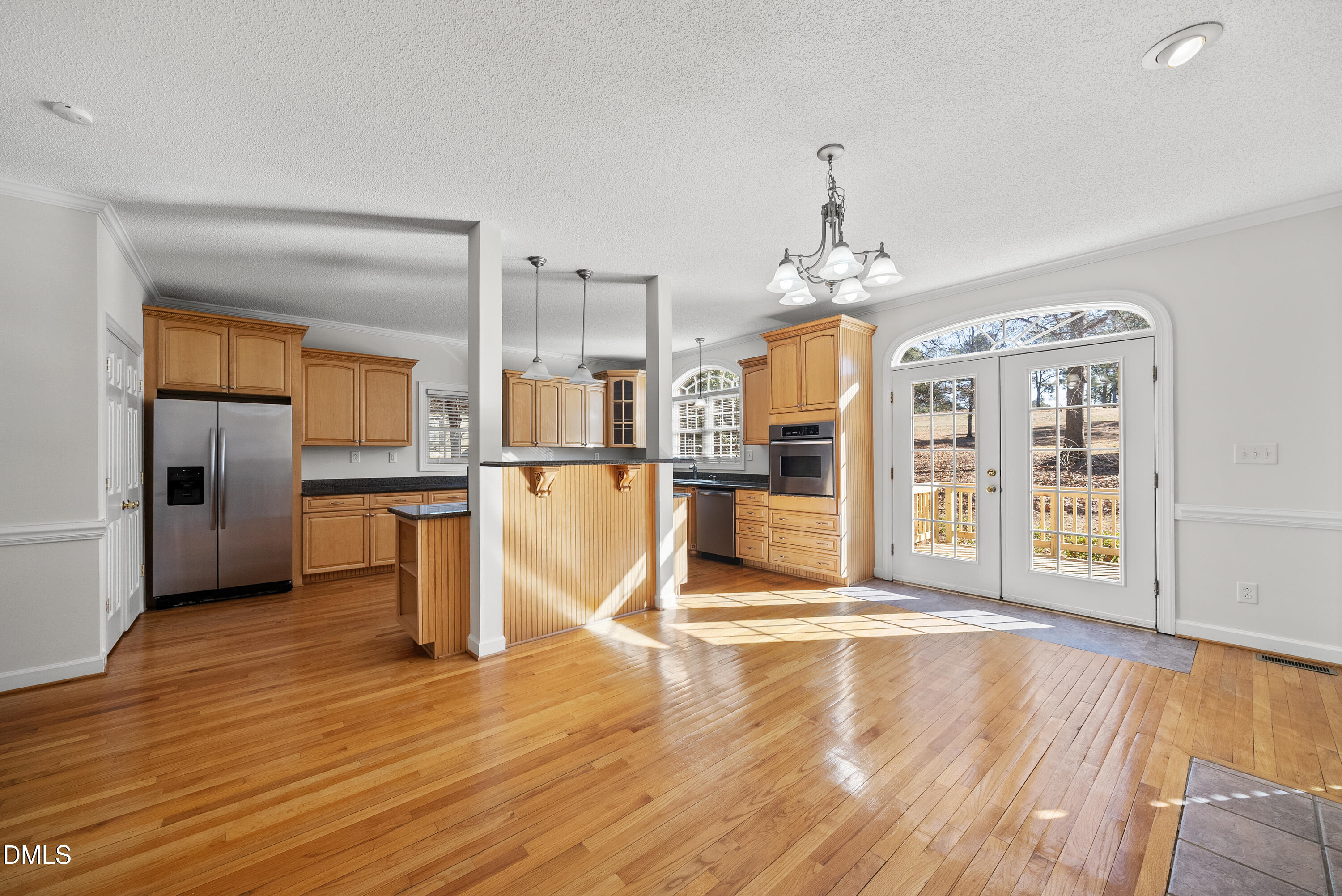 5833 Mockingbird Lane Sanford, NC 27332 - Photo 15 of 34 a view of a kitchen with wooden floor and a kitchen