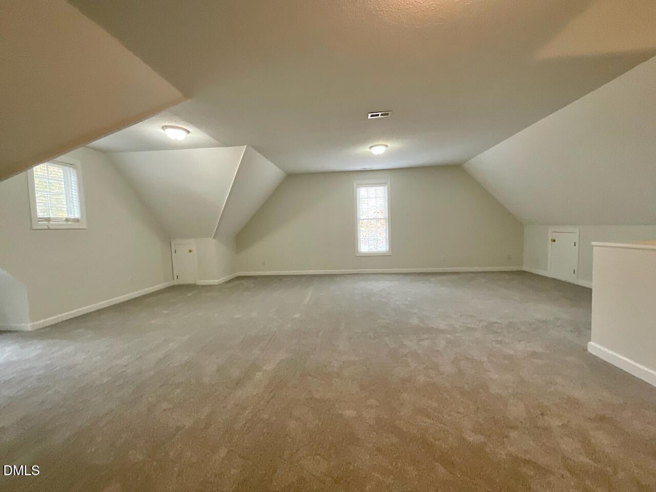 5833 Mockingbird Lane Sanford, NC 27332 - Photo 32 of 34 an empty room with a empty space and windows