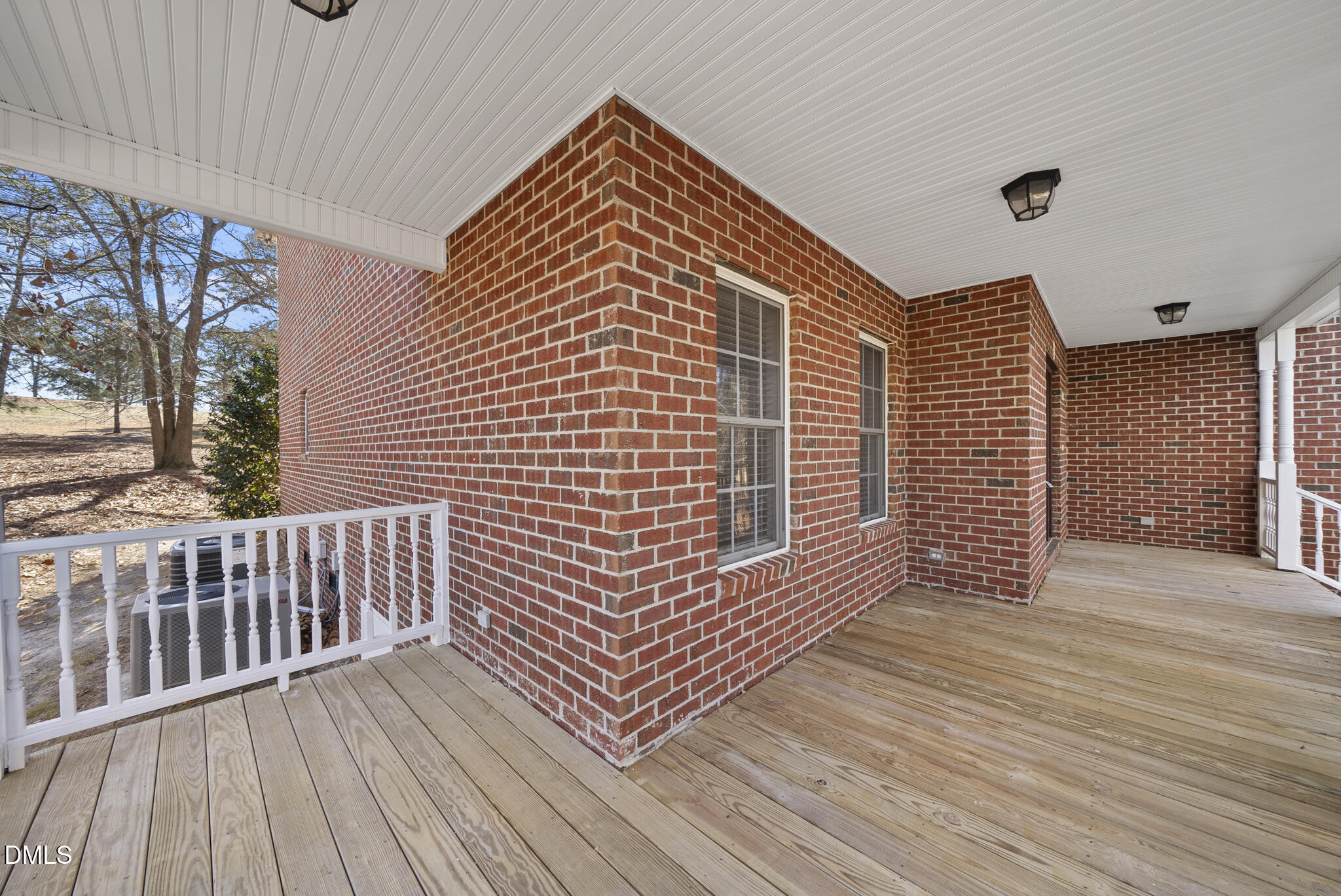 5833 Mockingbird Lane Sanford, NC 27332 - Photo 5 of 34 a view of a wooden deck