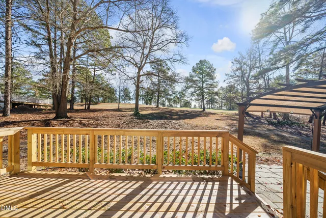 a view of a balcony with trees
