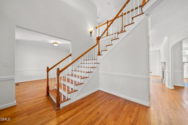 a view of entryway with wooden floor and stairs