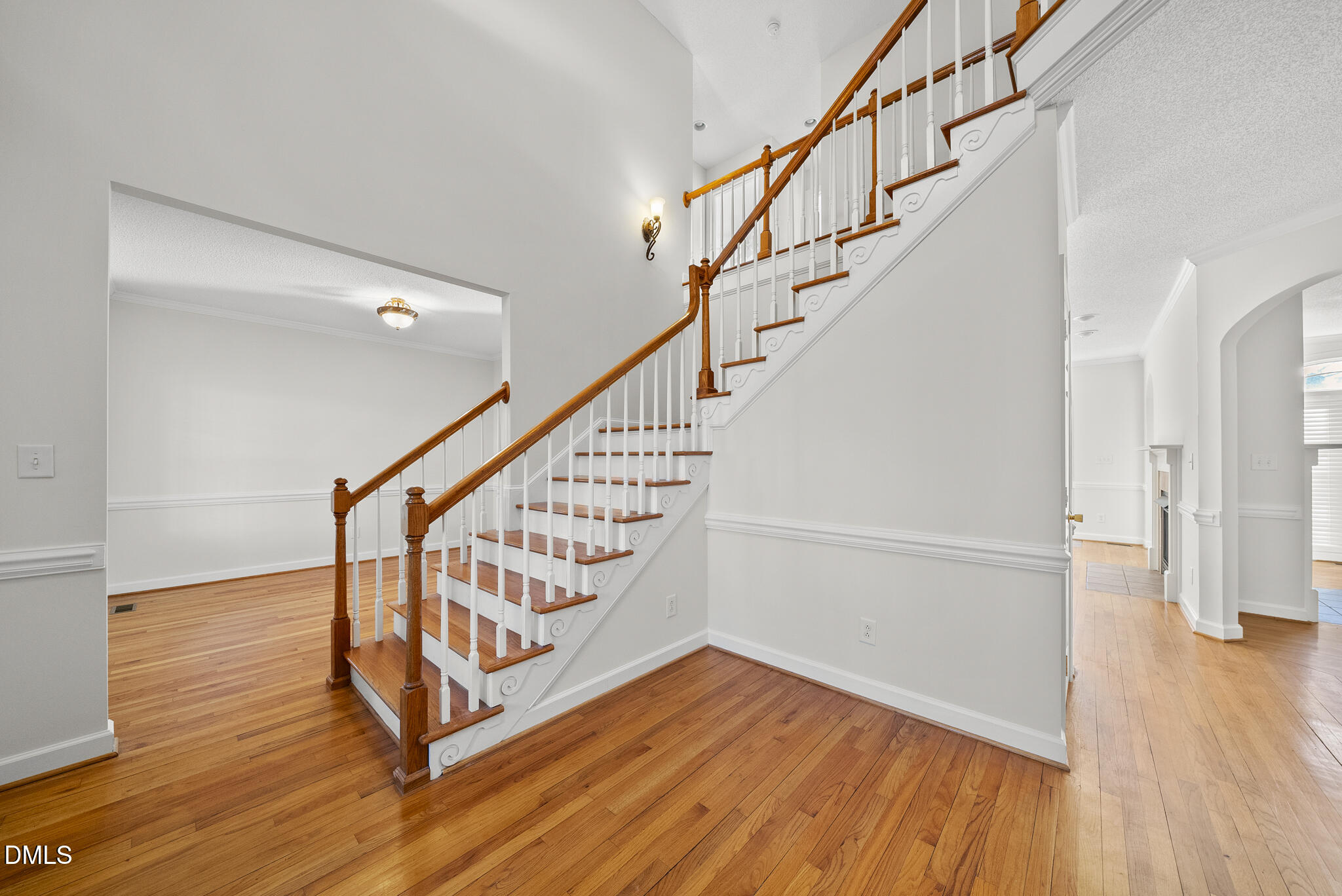 5833 Mockingbird Lane Sanford, NC 27332 - Photo 10 of 34 a view of entryway with wooden floor and stairs