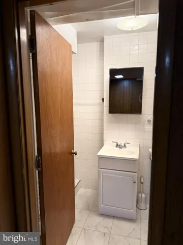 a bathroom with a toilet and a sink