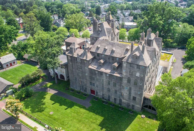 an aerial view of multiple houses with yard