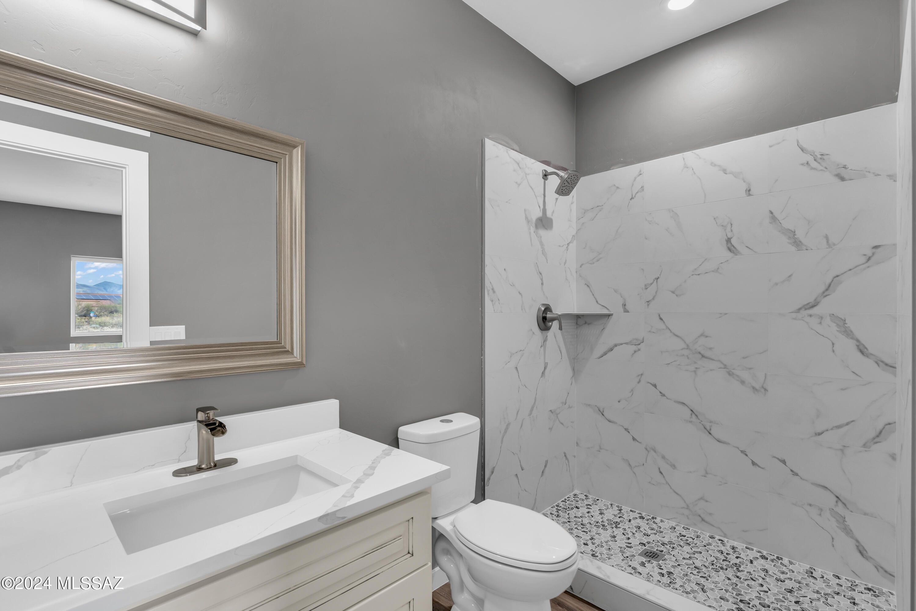 1840 La Paz Court Rio Rico, AZ 85648 - Photo 20 of 25 a bathroom with a sink toilet and shower
