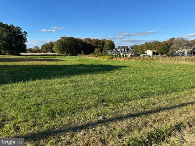 a view of a golf course with a lake