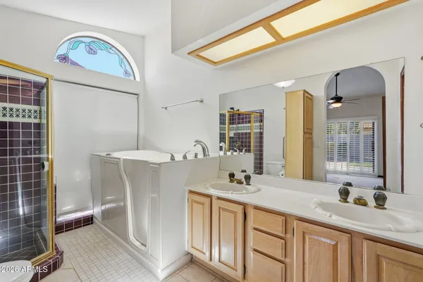 a view of bathroom with dual sinks