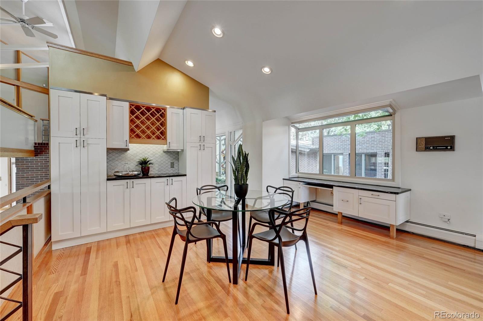 5140 Juniper Street Bow Mar, CO 80123 - Photo 20 of 40 a dining room with furniture and wooden floor