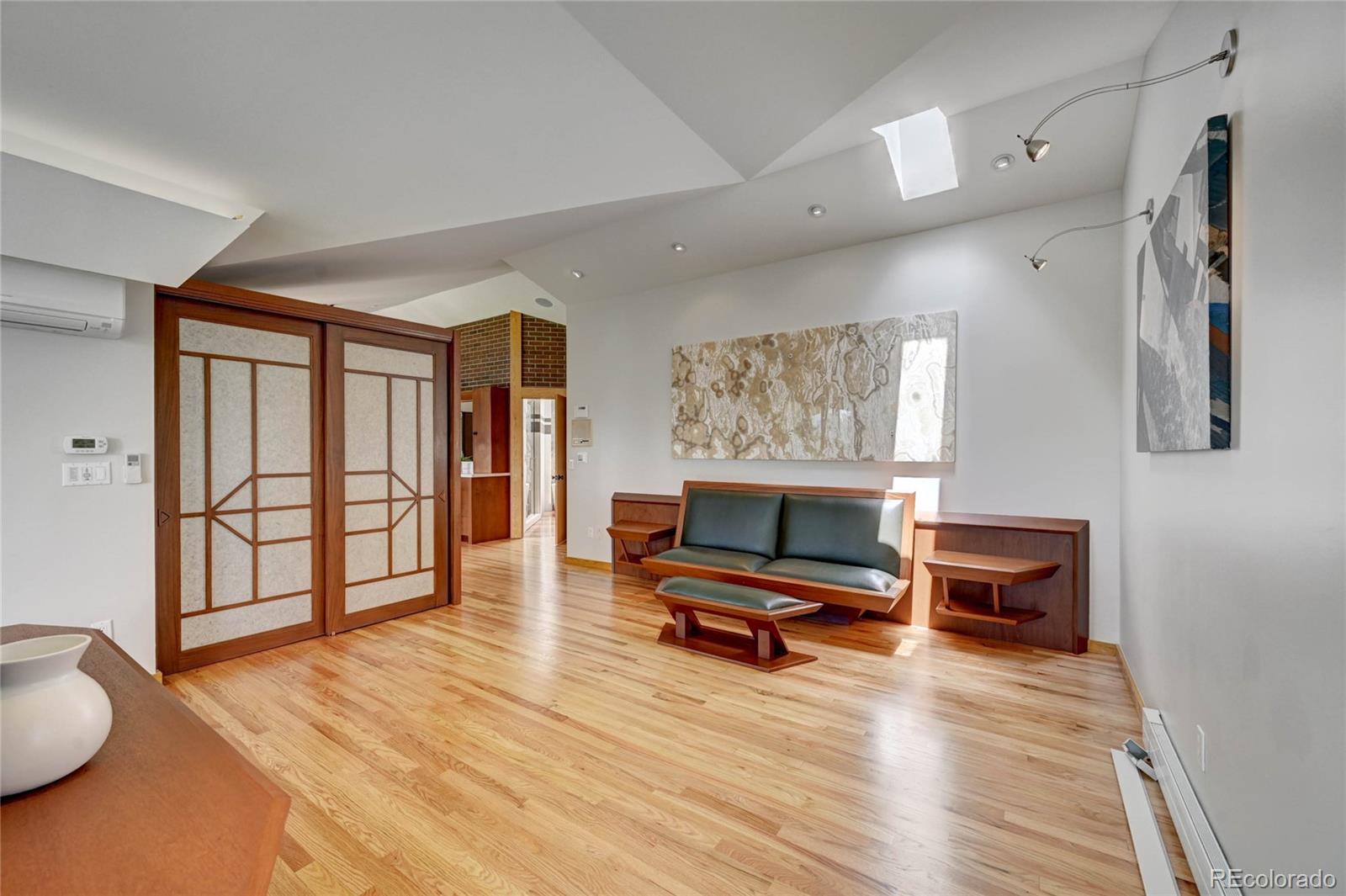 5140 Juniper Street Bow Mar, CO 80123 - Photo 23 of 40 a living room with furniture and a wooden floor