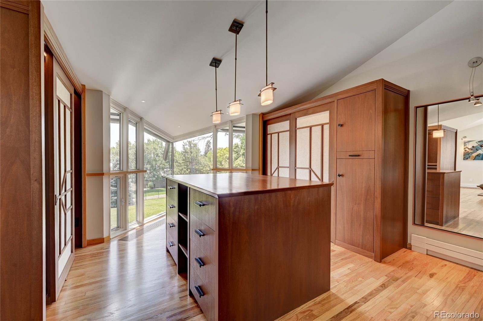 5140 Juniper Street Bow Mar, CO 80123 - Photo 25 of 40 a view of a room with wooden floor and windows