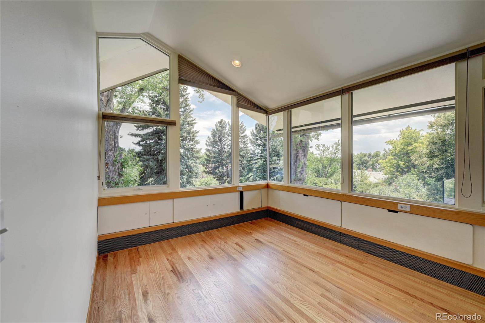 5140 Juniper Street Bow Mar, CO 80123 - Photo 27 of 40 a view of empty room with wooden floor and walls