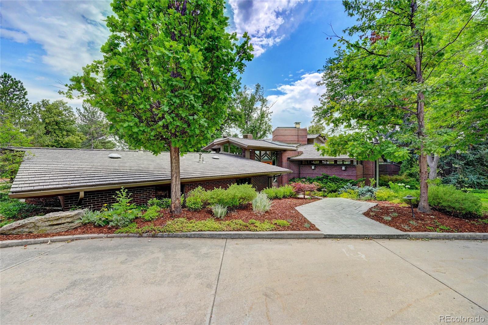 5140 Juniper Street Bow Mar, CO 80123 - Photo 3 of 40 front view of a house with a street