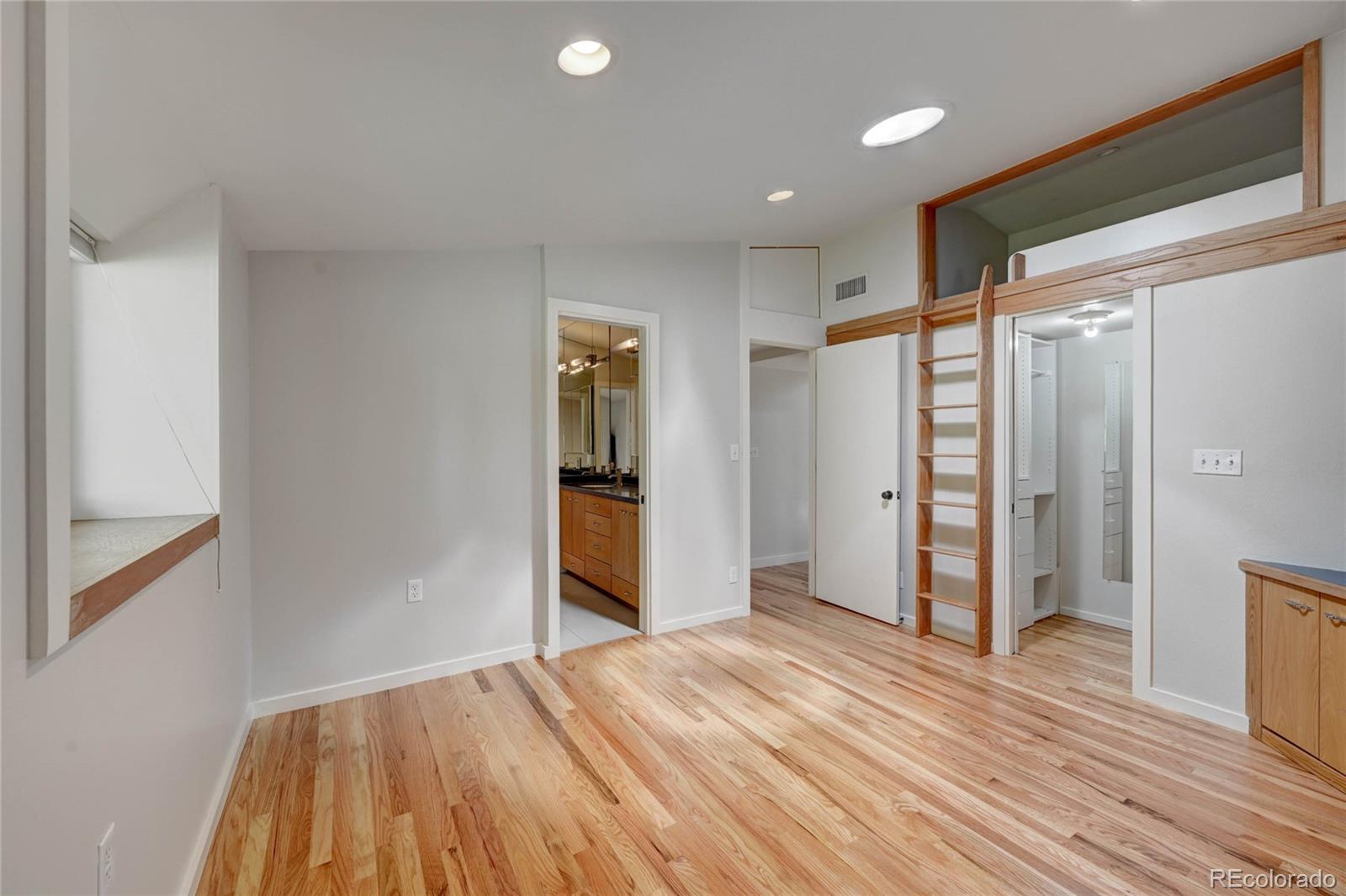 5140 Juniper Street Bow Mar, CO 80123 - Photo 32 of 40 a view of hallway with wooden floor